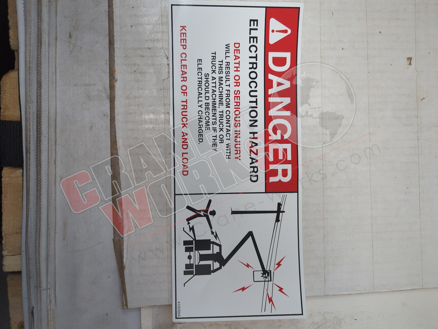 419266TU | New Decal Electrocution Hazard D/L