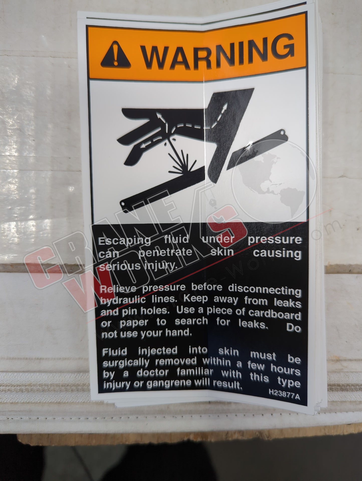 H23877TU | New Decal, Warning, Oil Leakage