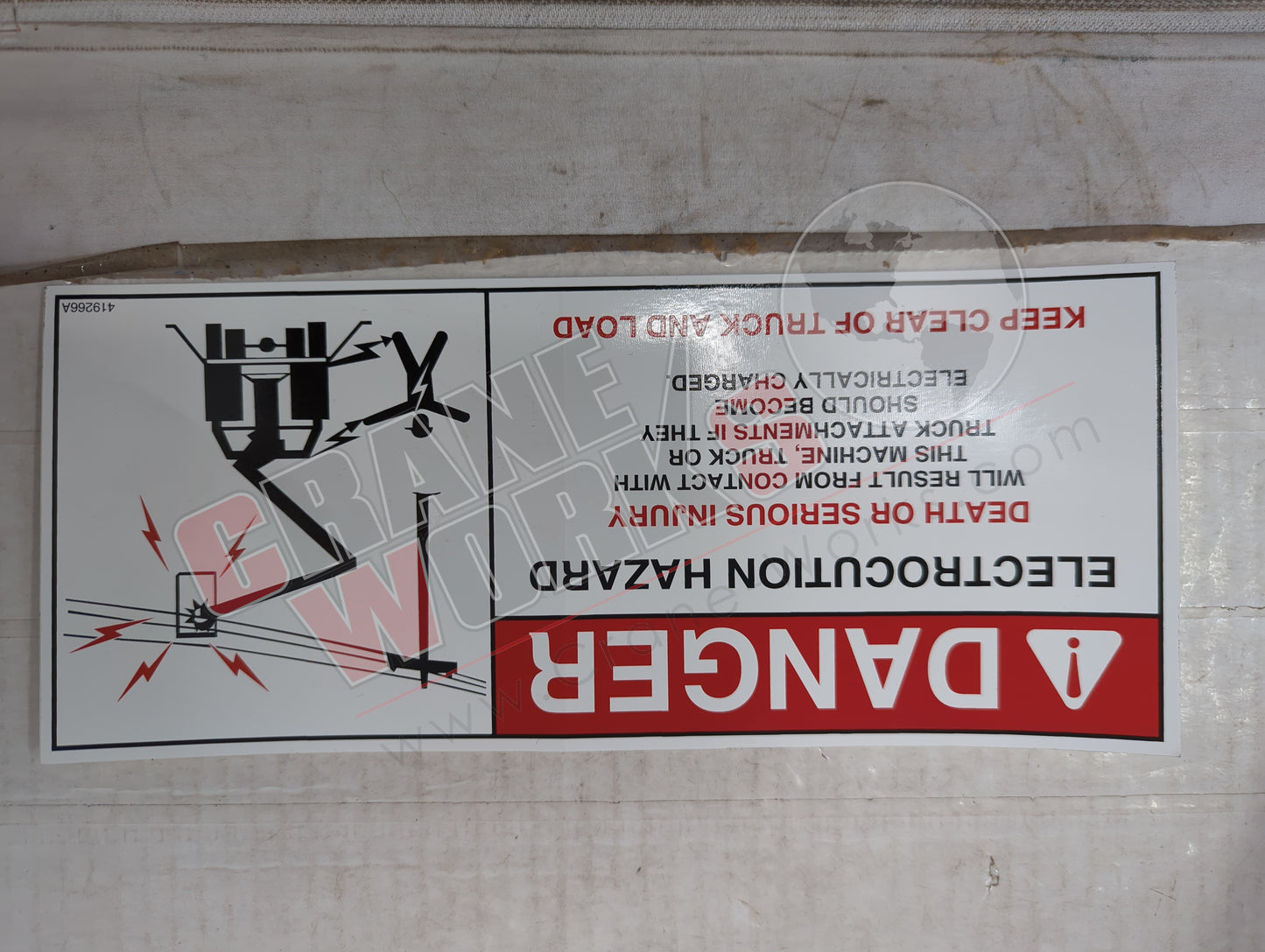 419266TU | New Decal Electrocution Hazard D/L