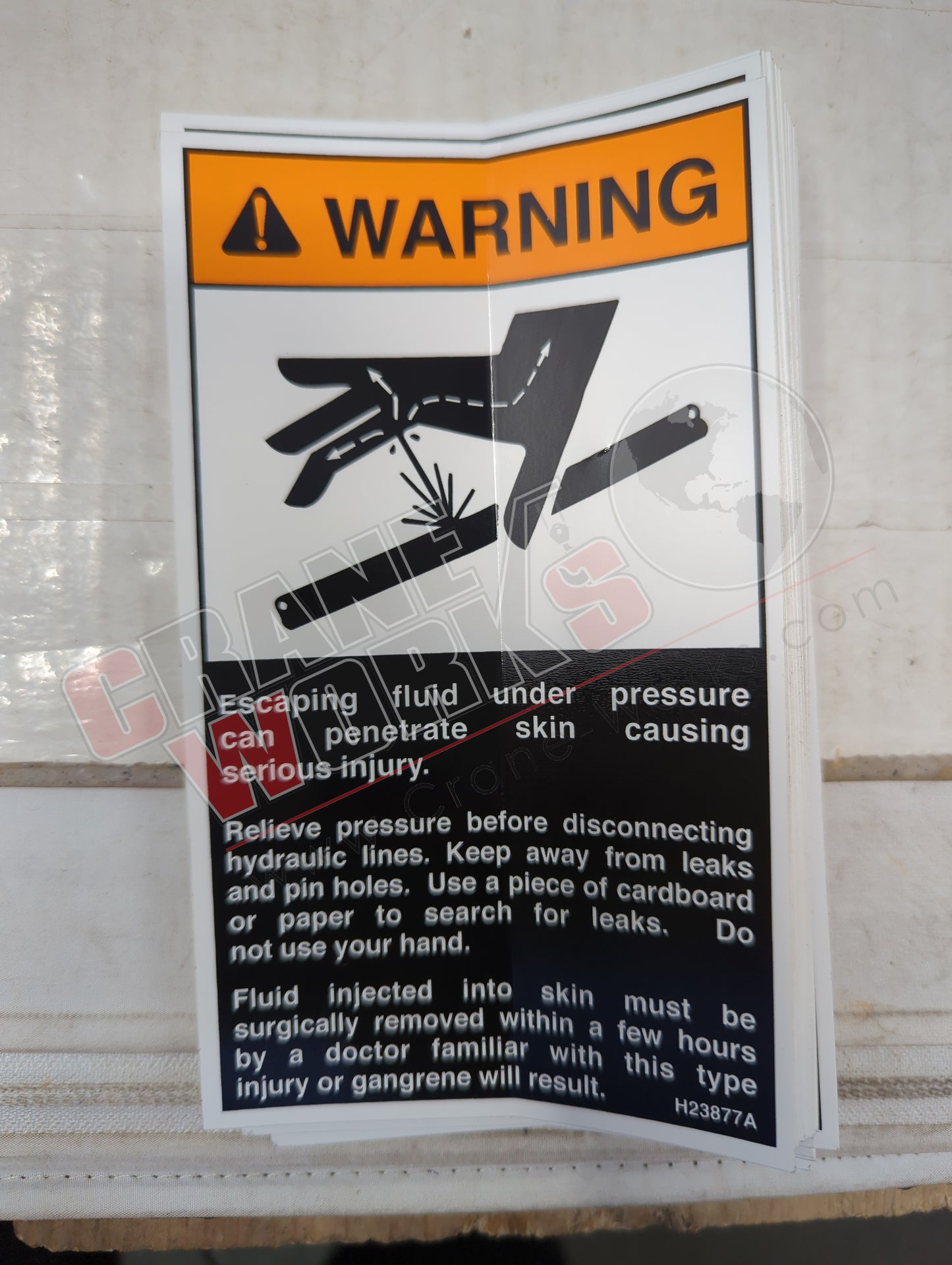 H23877TU | New Decal, Warning, Oil Leakage